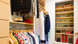 A bedroom closet that is organized and looked neat.