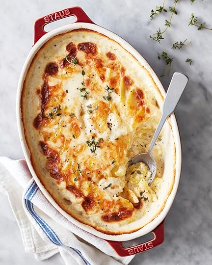 Dauphinoise potatoes in red casserole dish
