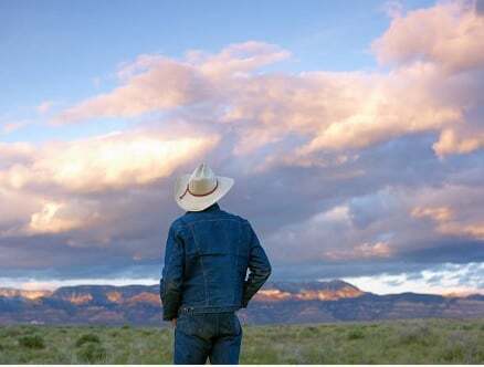 May be an image of 1 person, sky and text