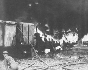 Firefighters at work after Japanese air raid on Singapore, 8 February 1942 (public domain via Wikipedia)