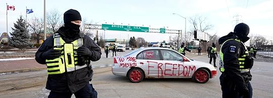 Police clear demonstrators near the US border