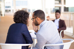Two colleagues gossiping