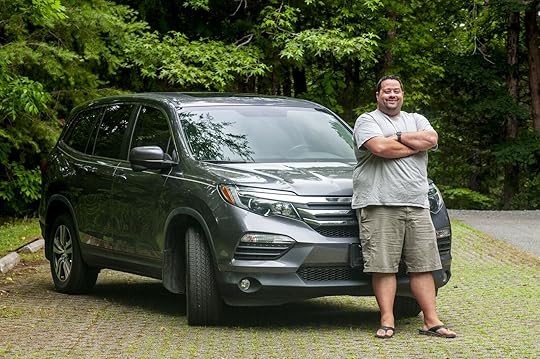 Jason Barnette, road trip expert, with his car.