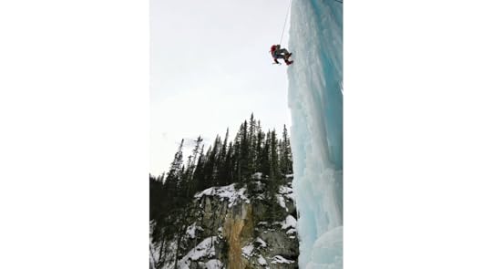 A climber rappeling down a pillar 