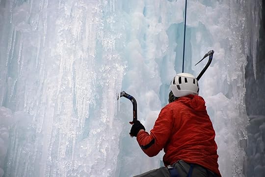 Ice climber with axes