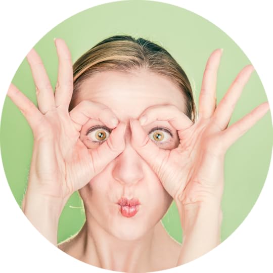 Woman looking through fingers