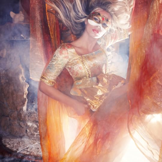 woman in orange gown who looks like a fairy