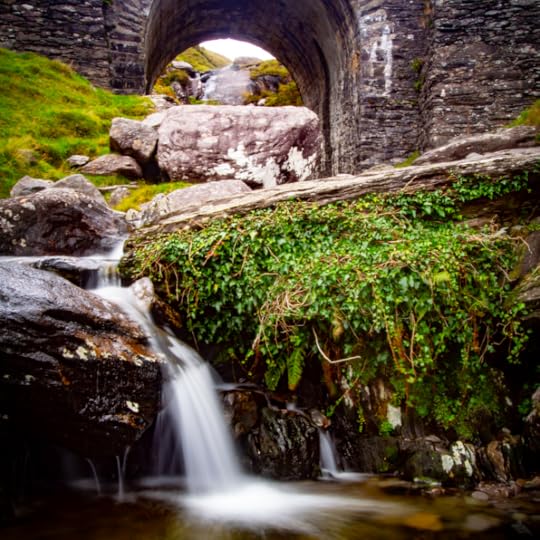 Irish stream under a stone arch
