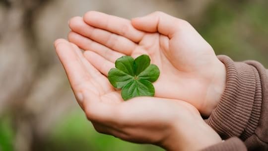 4 leaf clover in cupped hands