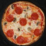 overhead of tortilla pizza on screen.