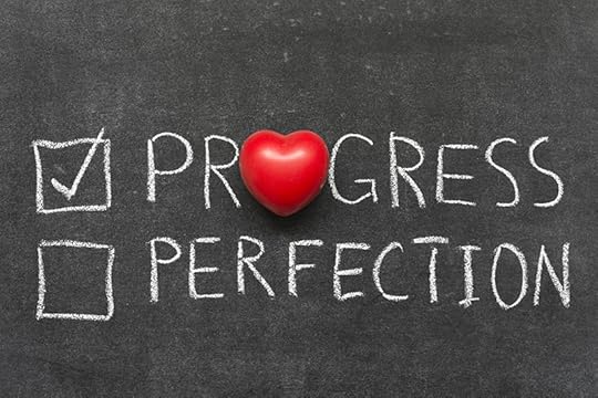 Photo of a chalkboard that has two words written on it: Progress and Perfection. The work perfection has a check mark in front of it and a red heart in place of the letter O. Helping dyslexic children to accept progress over perfection is a big reading teacher challenge.