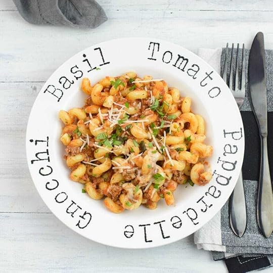 A white pasta bowl filled with a serving of Skillet pasta with ground beef sauce.