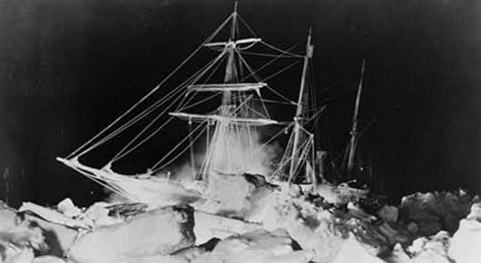 Black and white photo of a three-masted ship stuck in heavy ice