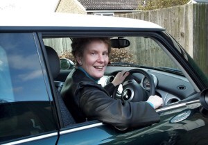 photo of Alison at the wheel of her Mini