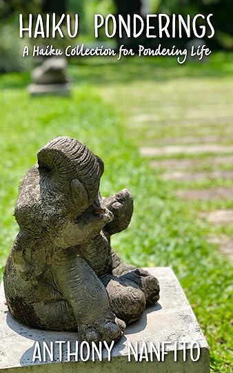 Elephant statue in a garden waving hi to you