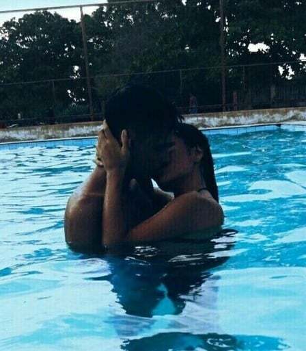 May be an image of 1 person, people kissing and pool