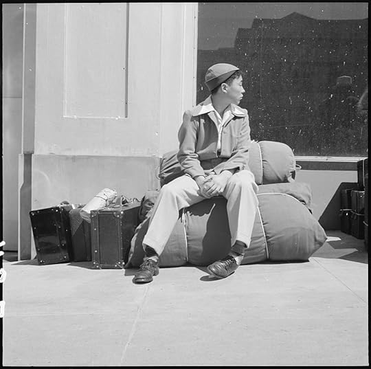 A boy and his personal effects at 2020 Van Ness Avenue as part of the contingent of 664 residents of Japanese ancestry, first to be evacuated from San Francisco on April 6, 1942 (US National Archives: 536059)