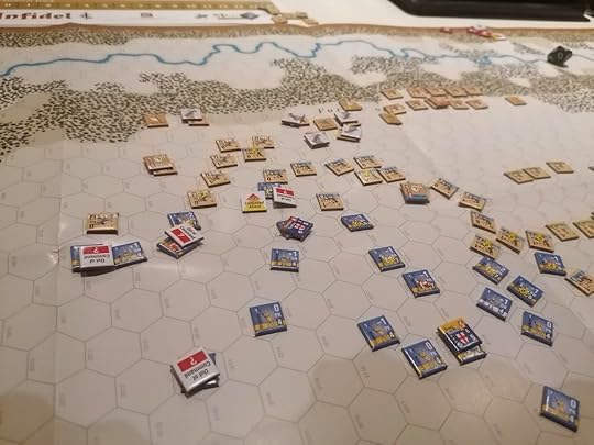 The crusader counters are scattered throughout the middle of the board - 6 have Out of Command tokens, and one has a Continuous Attack token showing he attacked his way out of formation. Numerous Retired Ayyubid tokens are also in shot at the back.
