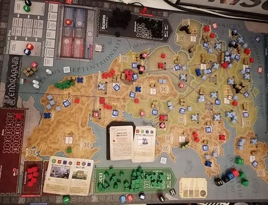 Picture of the game board, green Scotti pieces are on the left, black Saxons in top centre, and Red Dux and Blue Civitates scattered throughout the board.