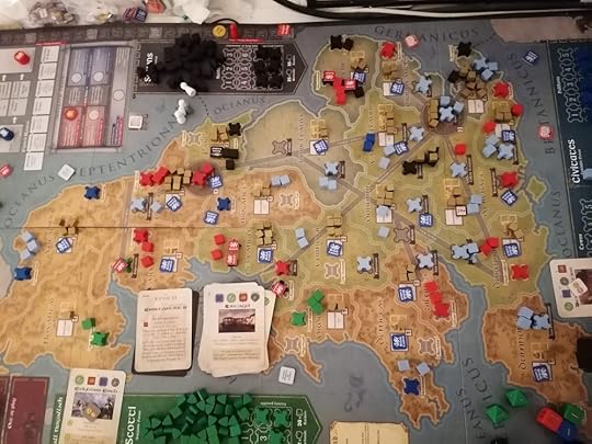 Board with the final Epoch card showing. All the raider cubes have been removed, a few barbarian settlements are left but there are still a lot of prosperity cubes on the board.
