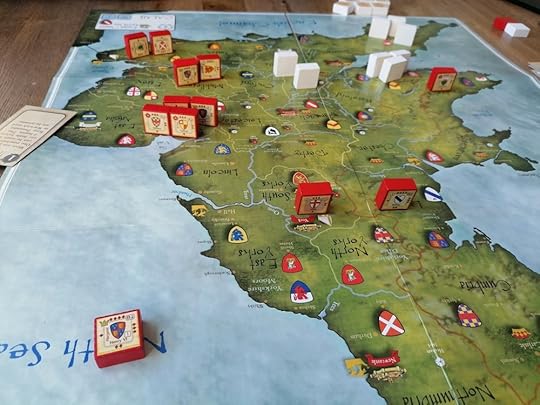Red blocks take up the top left and center of the board, a smaller number of white blocks are in the top right along with one red block. The block of Henry VI is in the lower off the game map.