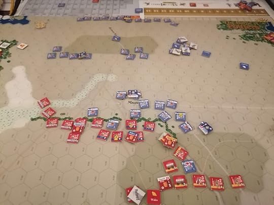 English units have begun encircling on the left and the right flanks, making their line more like a W shape than a line. The French have consolidated into the center-right of the English lines.