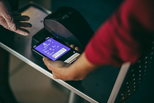 person scanning phone at airport