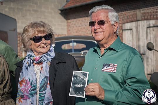 Bob, holding a photo of Paulette in the baby carriage where his father was hidden