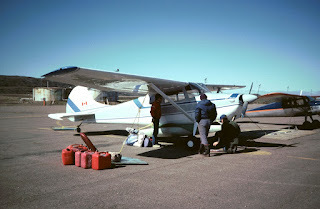 Lashing the kayaks to the airplane