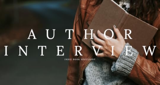 a woman in a leather jacket and grey jumper holding an open book, text says 'author interview: indie book spotlight' 