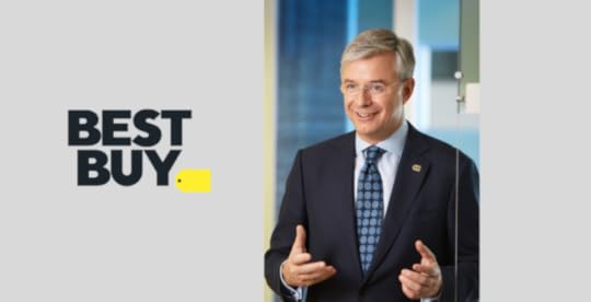 Photo of former Best Buy CEO Hubert Joly with Best Buy logo