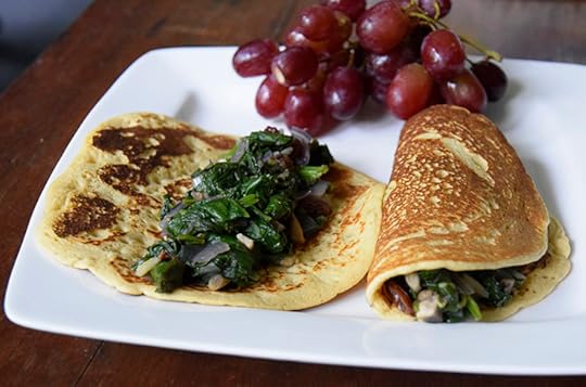 chickpea egg-free omelet with greens, mushrooms, onions, and red grapes
