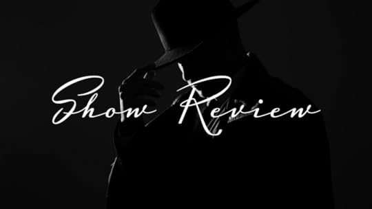 a man in shadow tilting his hat with his fingers, very noir; text says 'show review'