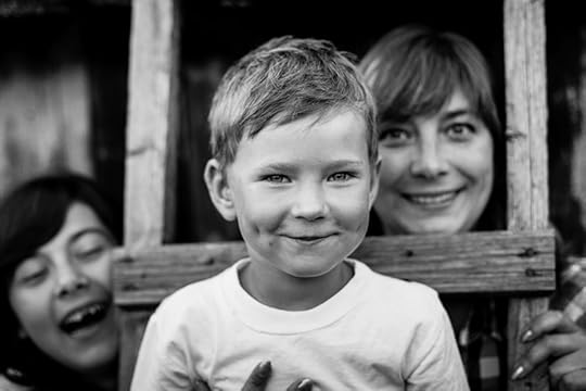 black and white photo of a young boy, his mother, and his sister in and around a rustic ladder. Dyslexia is like black-and-white photography in a way. Sometimes a limitation imposed on a creative process can produce beautiful results.