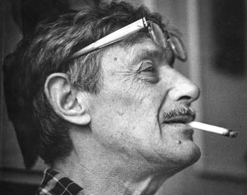 Viktor Nekrasov profile shot with cigarette and glasses perched on head