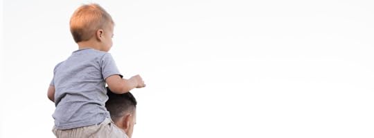 Son on dads shoulders