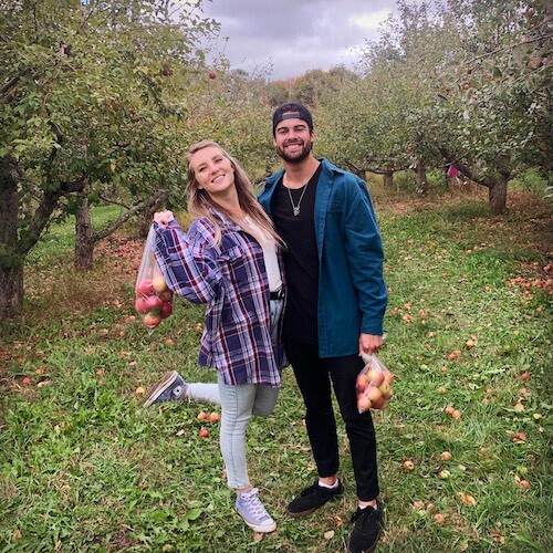 Couple picking apples