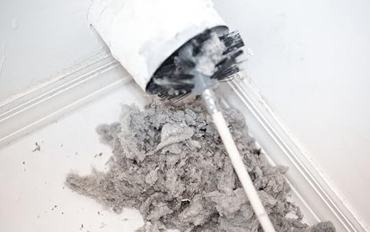 lint from dryer vent with brush cleaning it out 