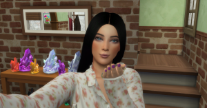 An attractive young adult female Sim blows a kiss at the viewer. 