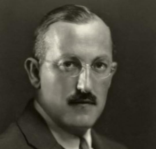 Black and white headshot of Johnston, circa 1921. He wears a suit and tie, wire-rimmed glasses and a moustache. He looks directly at the camera, unsmiling.