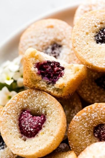 brown butter berry tea cake with bite taken out to show center