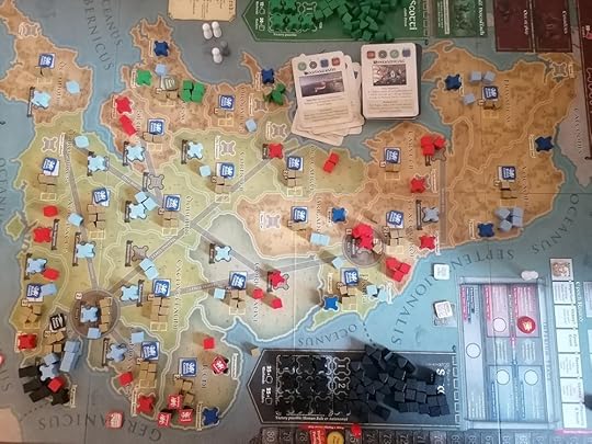 Pendragon's board. There are black Saxon pieces and a settlement on he bottom left of the image, and green Scotti cubes and settlement in the top centre.