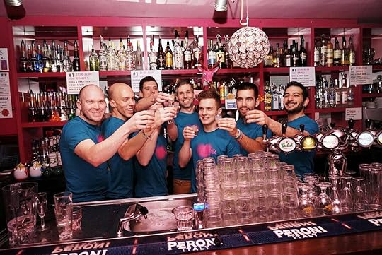 Bartenders raise a glass behind gay Amsterdam bar PRIK