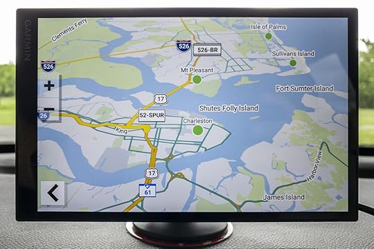 Garmin SmartDrive 76 GPS device mounted on vehicle dashboard. This is one of the best GPS for road trips