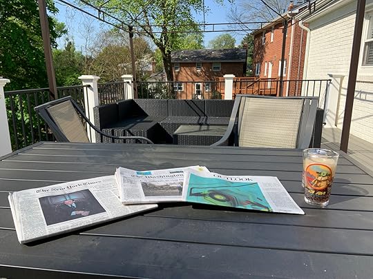 Reading the Sunday papers on the deck before I had the gazebo setup this past weekend.