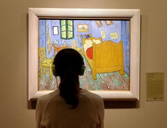 person admiring Van Gogh's 