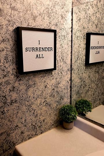 Framed marquis on bathroom wall that reads