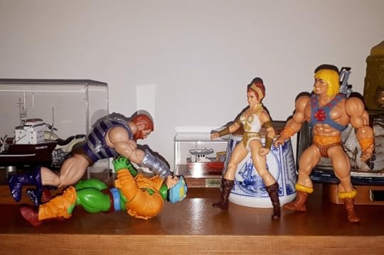 Duncan and Fisto are tussling, while Teela and He-Man prepare to step in.