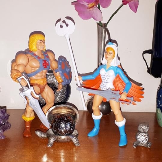 The Sorceress shows He-Man the Orb of Powe