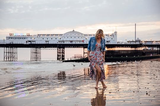 Woman standing on Brighton beach day trip from gay London